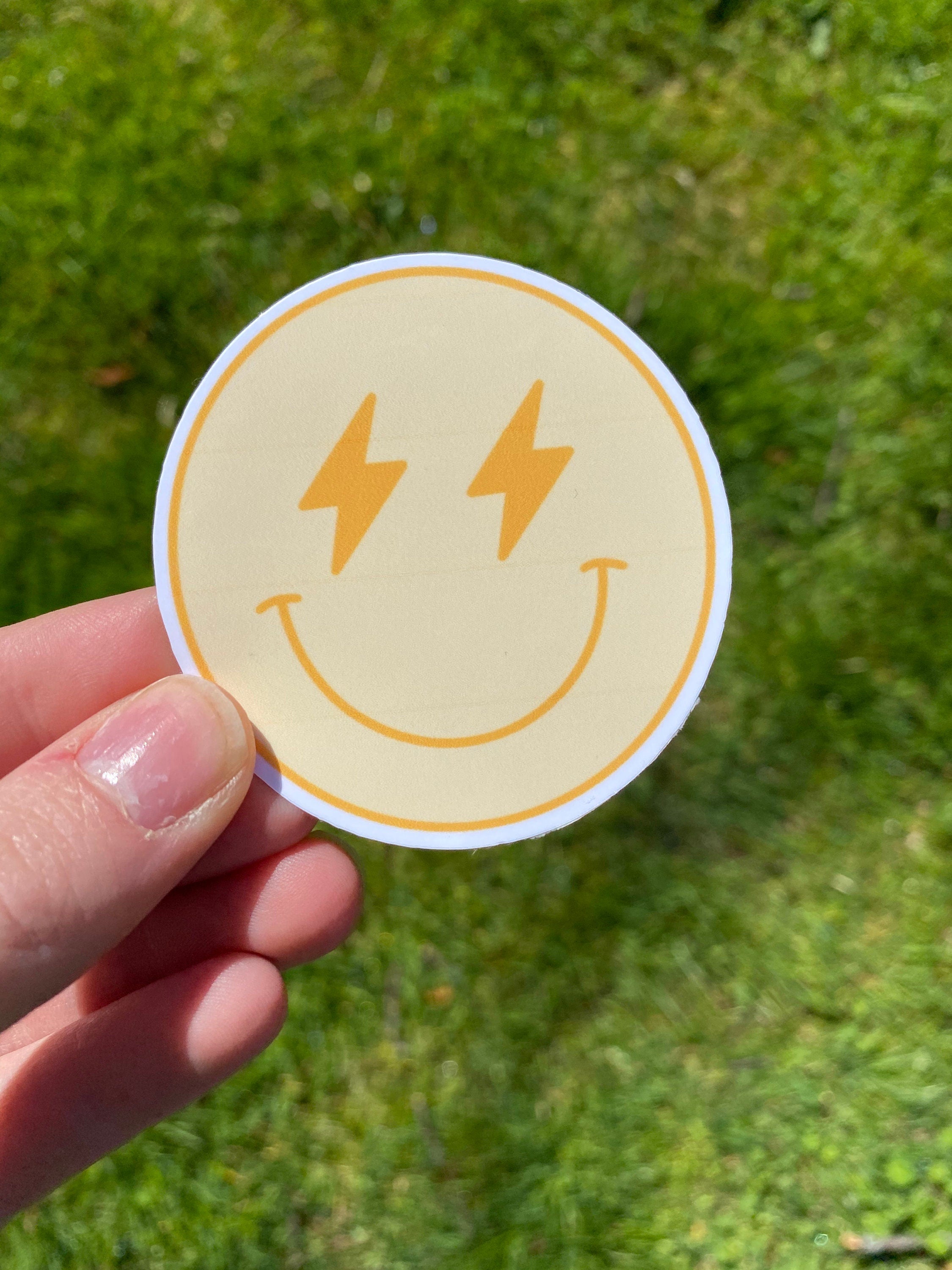 Lighting bolt smiley face sticker