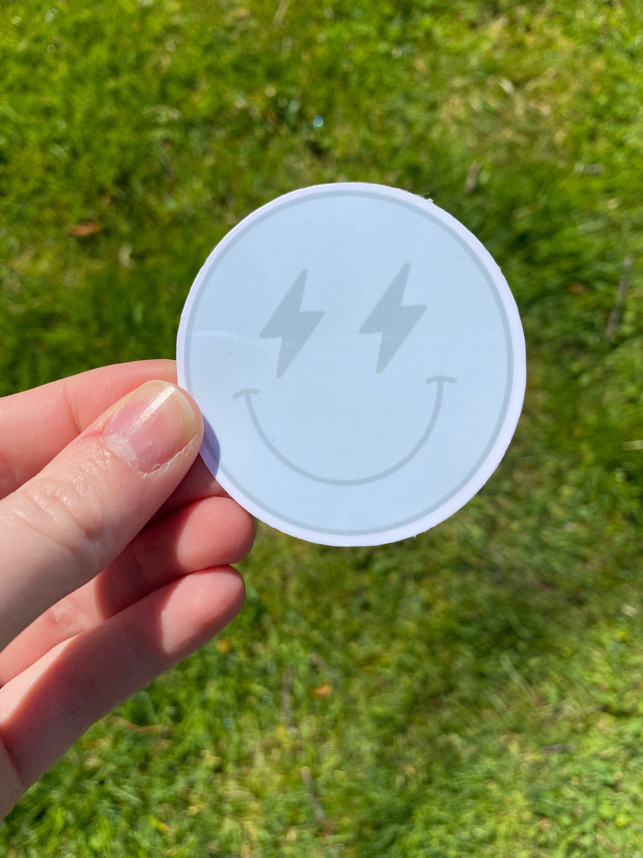 Lighting bolt smiley face sticker