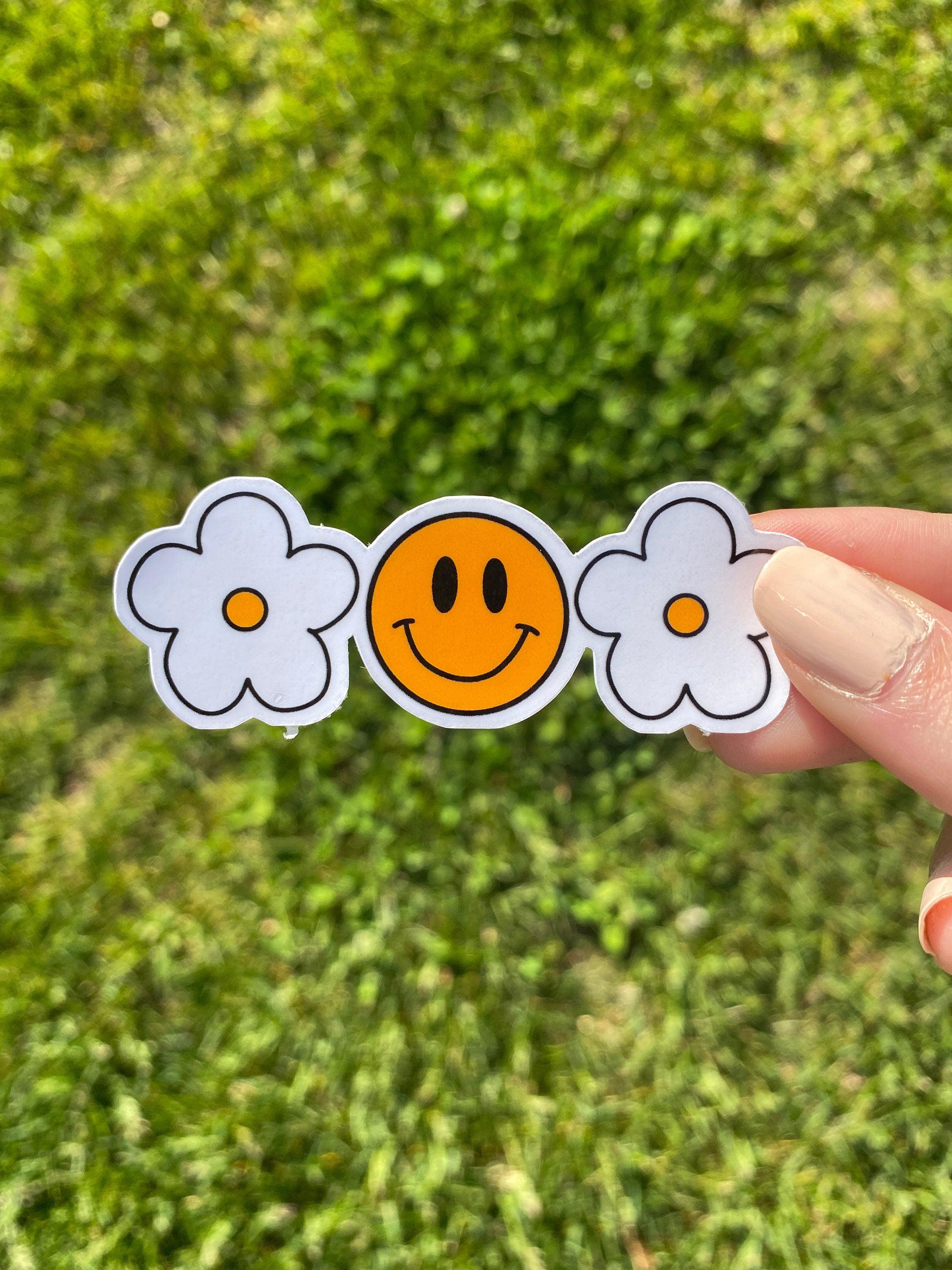Smiley face flower sticker